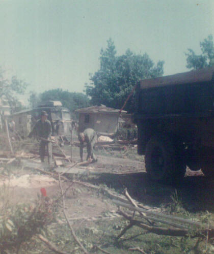 Freeburg, IL - Service men picking up debris.